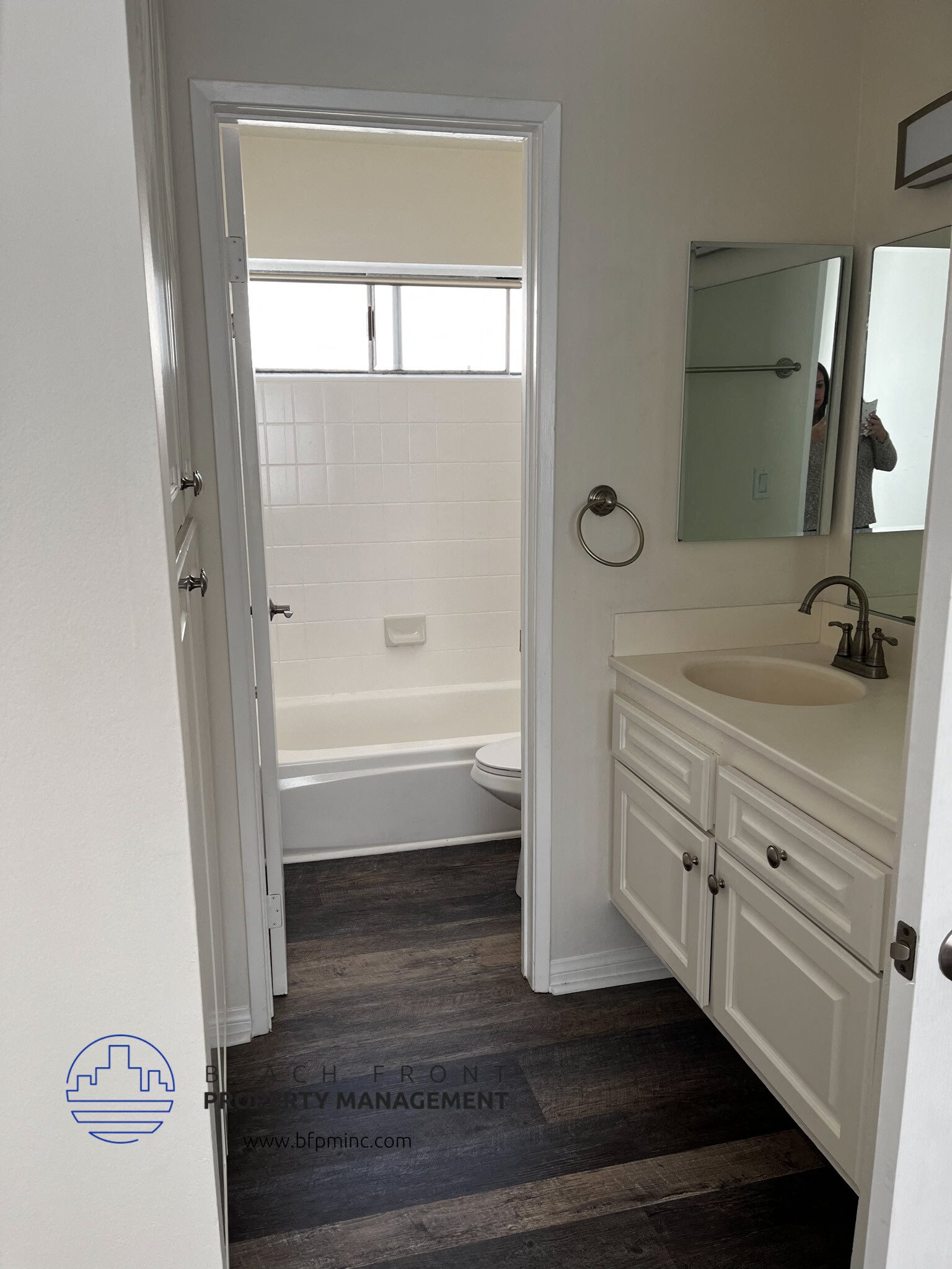 a bedroom with a medium sized bathroom with a bathtub and a sink